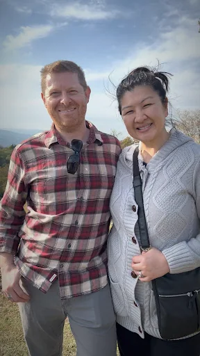 Derek with his wife on a trip